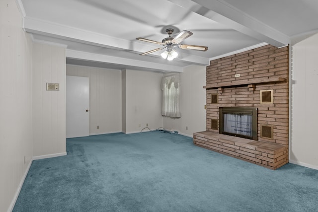 unfurnished living room with carpet floors, beamed ceiling, a brick fireplace, and ornamental molding