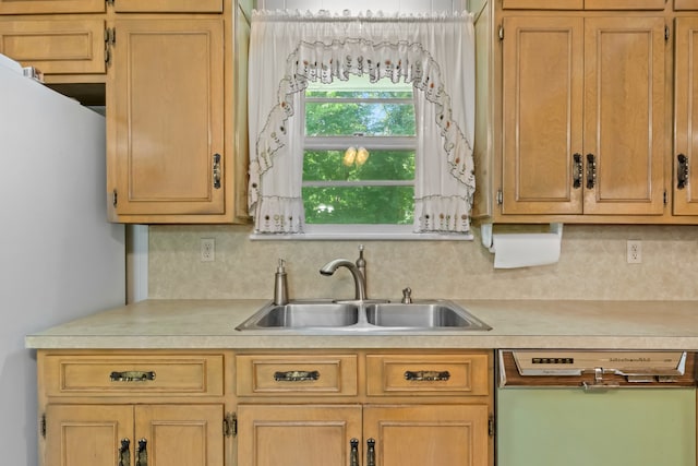 kitchen featuring light brown cabinetry, sink, tasteful backsplash, and dishwashing machine