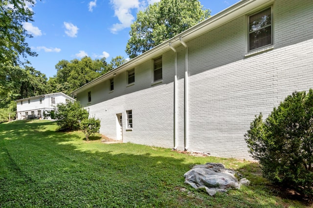 view of property exterior featuring a yard