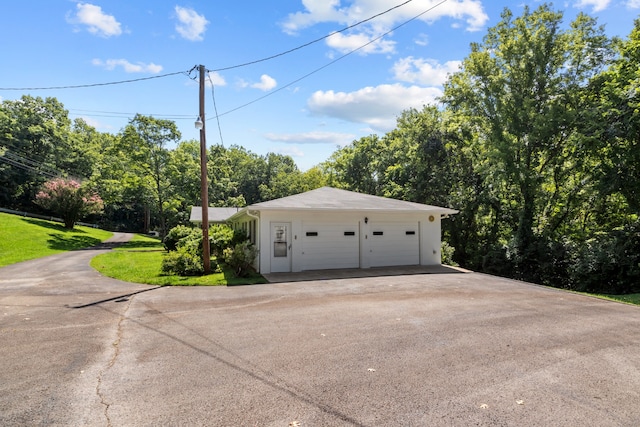 garage with a yard