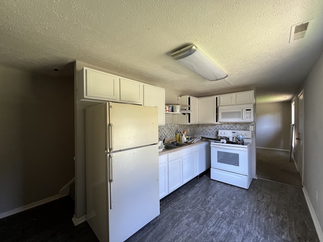 kitchen featuring white cabinets, white appliances, sink, and backsplash