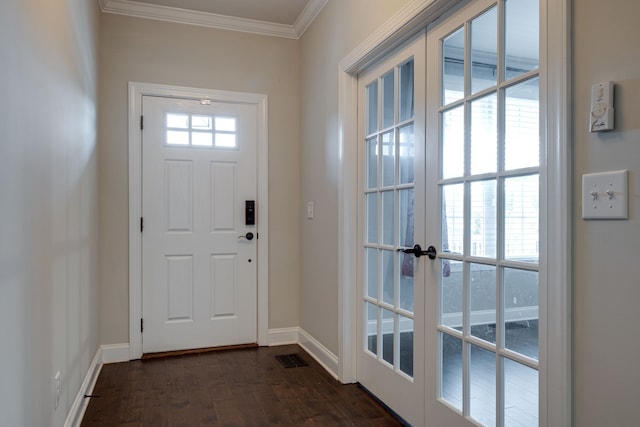 doorway featuring ornamental molding, dark wood-type flooring, and french doors