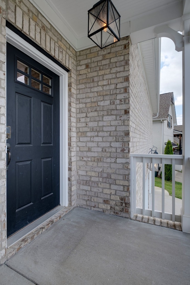 doorway to property with covered porch