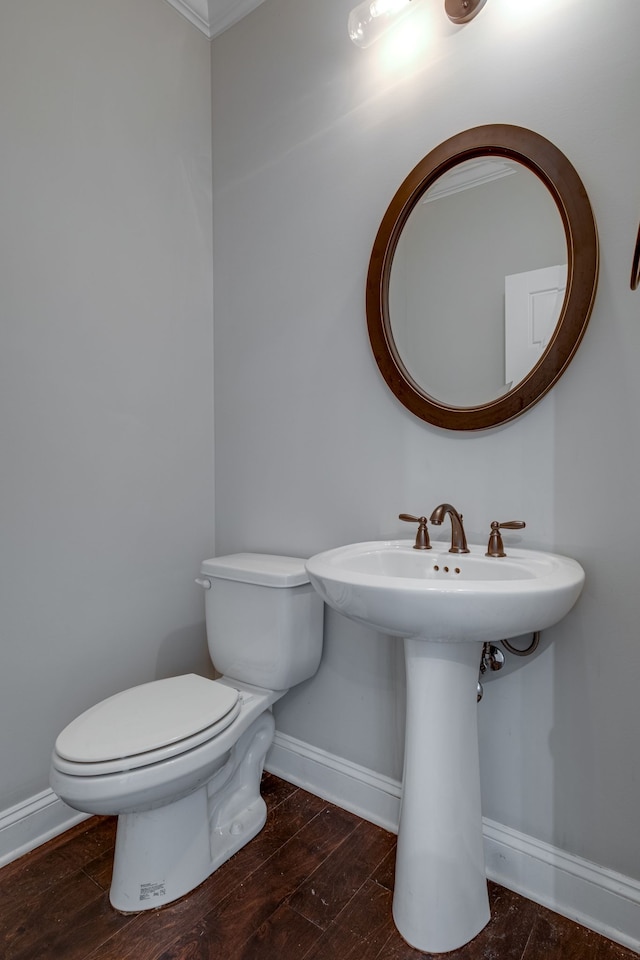 bathroom featuring toilet and hardwood / wood-style flooring