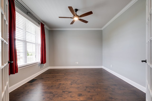 empty room featuring ornamental molding, ceiling fan, and dark wood-type flooring