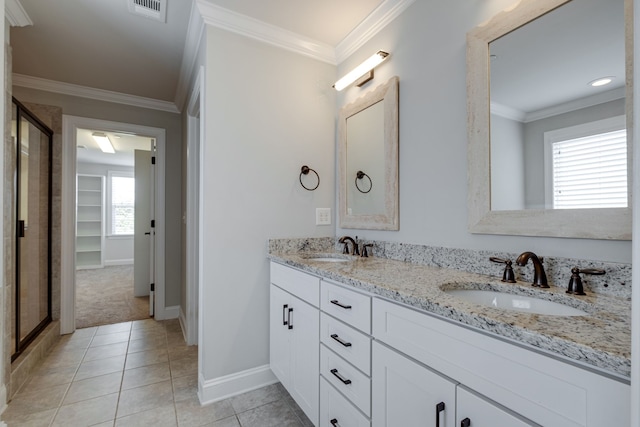 bathroom with ornamental molding, tile patterned floors, and vanity