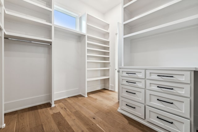 walk in closet featuring light hardwood / wood-style flooring