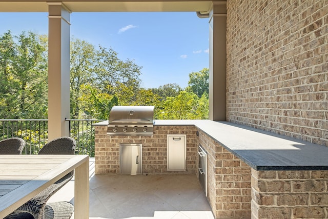 view of patio featuring a grill and exterior kitchen