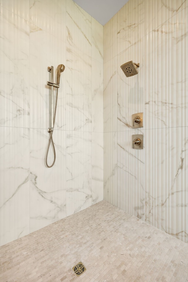 bathroom with tiled shower