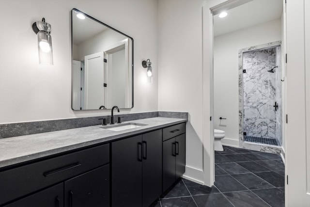 bathroom with tile patterned floors, vanity, toilet, and a shower with door