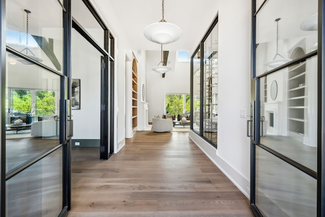 corridor with wood-type flooring