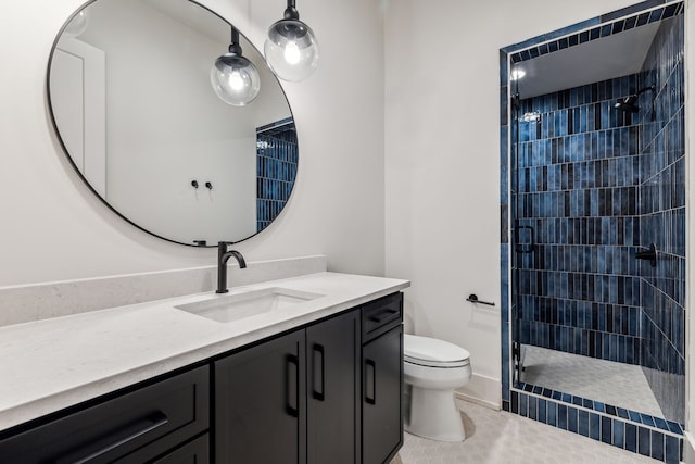 bathroom featuring tile patterned flooring, a tile shower, vanity, and toilet