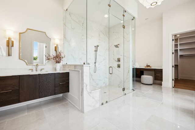 bathroom featuring vanity and a shower with shower door