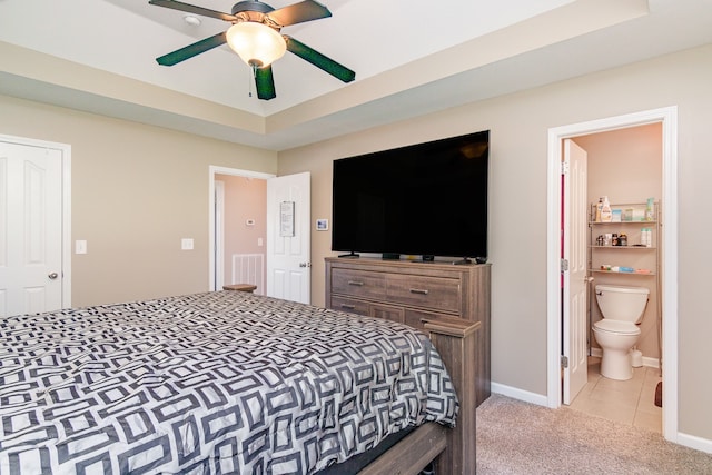 carpeted bedroom featuring ceiling fan and connected bathroom