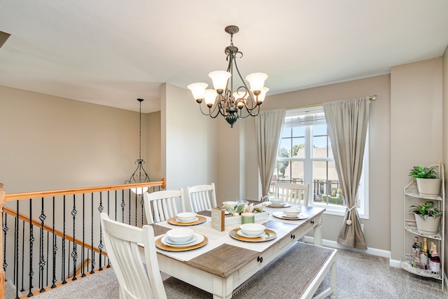 carpeted dining room with an inviting chandelier