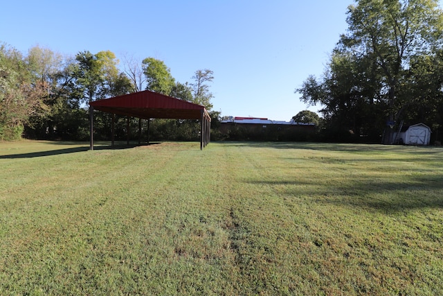 view of yard featuring a shed and a gazebo