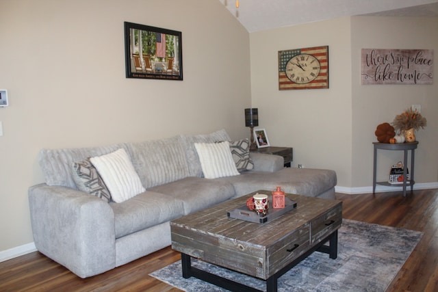 living room with lofted ceiling and dark wood-type flooring