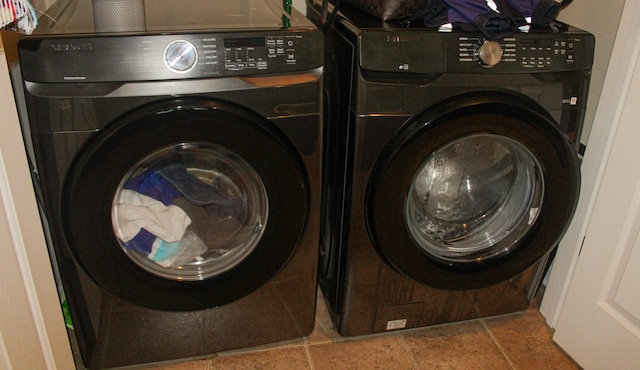 laundry room with separate washer and dryer