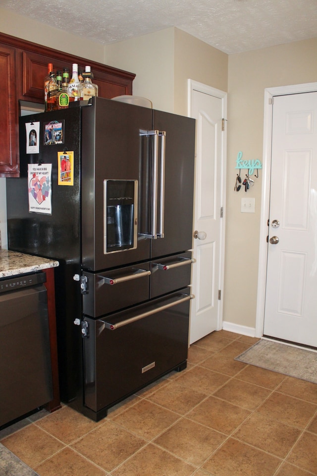 kitchen featuring a textured ceiling, tile patterned flooring, high quality fridge, and dishwasher