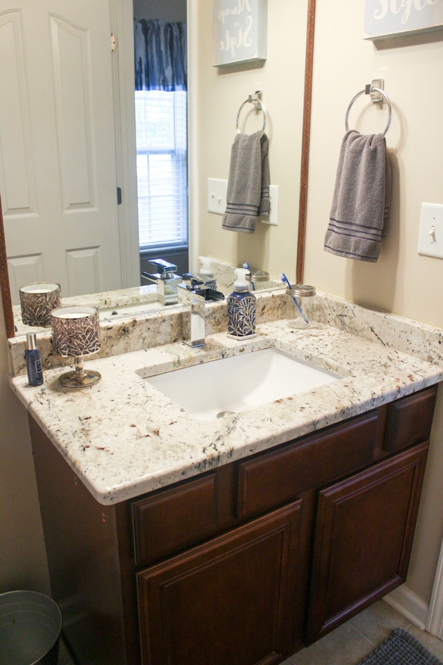 bathroom featuring vanity and tile patterned flooring