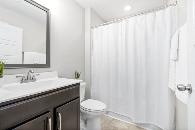 bathroom with tile patterned floors, vanity, toilet, and a shower with curtain