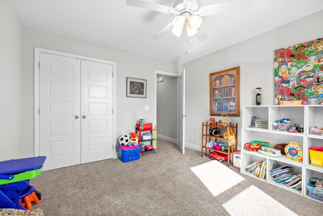 game room with ceiling fan and carpet