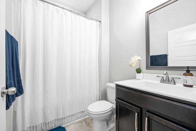 bathroom featuring walk in shower, vanity, and toilet