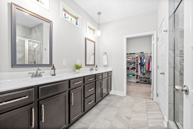 bathroom featuring an enclosed shower and vanity