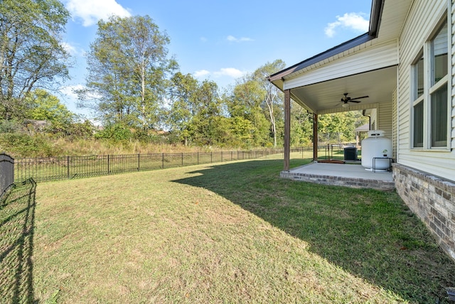 view of yard with ceiling fan, a patio, and central air condition unit