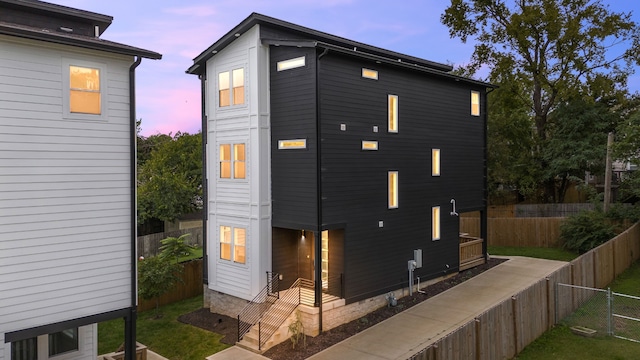 view of property exterior at dusk