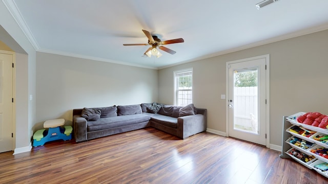 living room with ceiling fan, hardwood / wood-style flooring, and ornamental molding