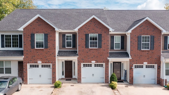 multi unit property featuring a garage