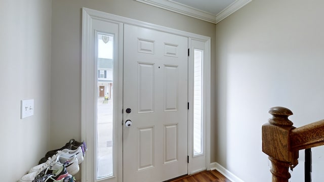 foyer featuring ornamental molding and wood-type flooring