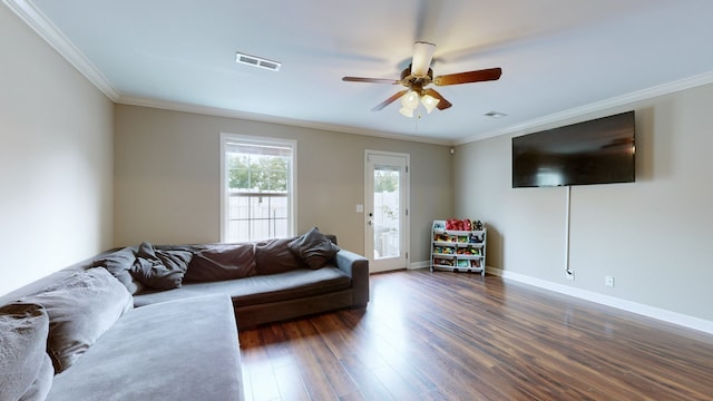 living room with ceiling fan, dark hardwood / wood-style floors, and crown molding