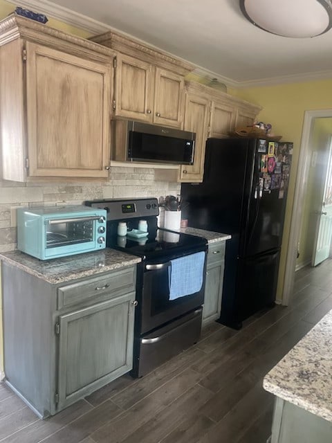 kitchen with decorative backsplash, light brown cabinets, ornamental molding, black appliances, and dark hardwood / wood-style flooring