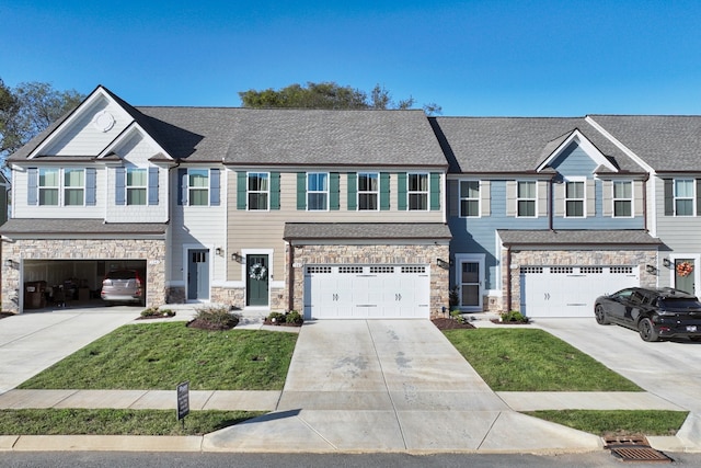 townhome / multi-family property featuring a garage