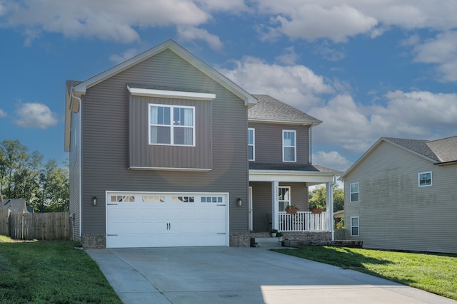 view of front of house featuring a front lawn, a porch, and a garage