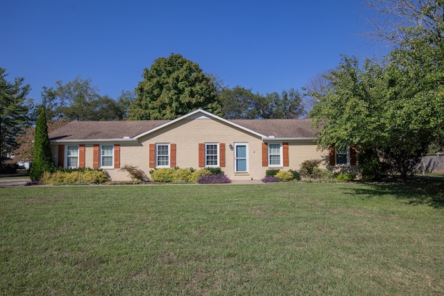 single story home featuring a front yard