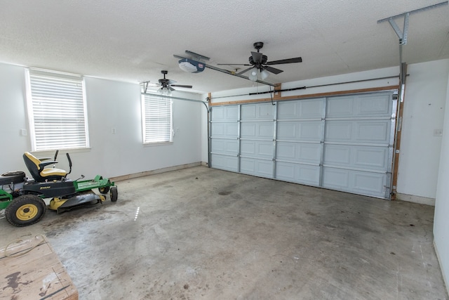 garage with a garage door opener and ceiling fan