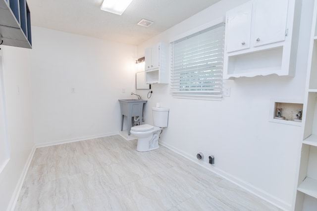 bathroom with sink and toilet