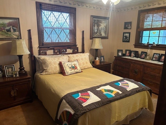 bedroom with ceiling fan and carpet