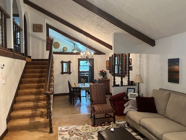 tiled living room with vaulted ceiling with beams and a chandelier