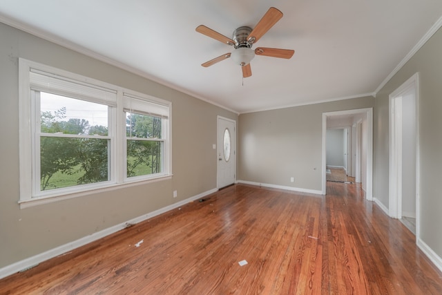 unfurnished room with ceiling fan, crown molding, and hardwood / wood-style floors