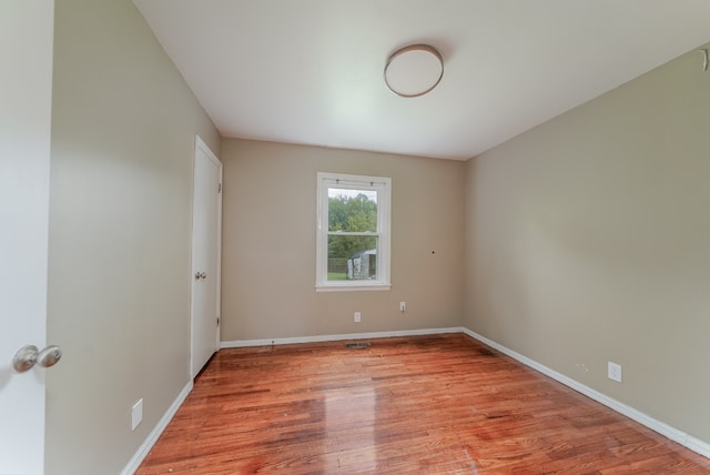 spare room with light wood-type flooring