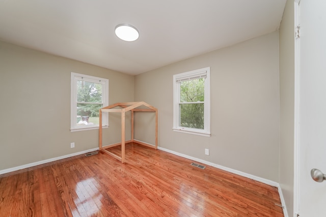 spare room featuring light hardwood / wood-style flooring