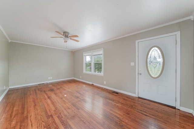 entryway featuring ceiling fan, hardwood / wood-style flooring, and ornamental molding