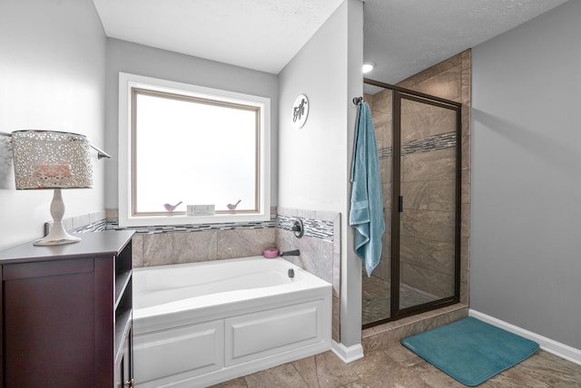 bathroom featuring a textured ceiling, independent shower and bath, and tile patterned floors