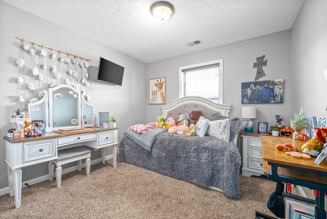 carpeted bedroom with a textured ceiling