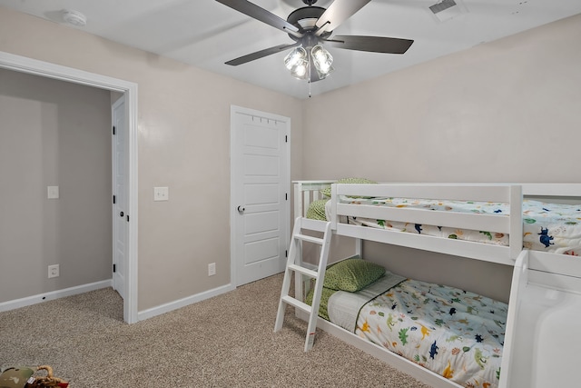 bedroom featuring ceiling fan and carpet floors