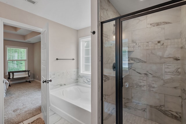 bathroom featuring plus walk in shower